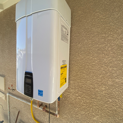 Tankless water heater mounted on wall with digital display and yellow energy efficiency label, showcasing installation for optimized hot water supply in residential settings.